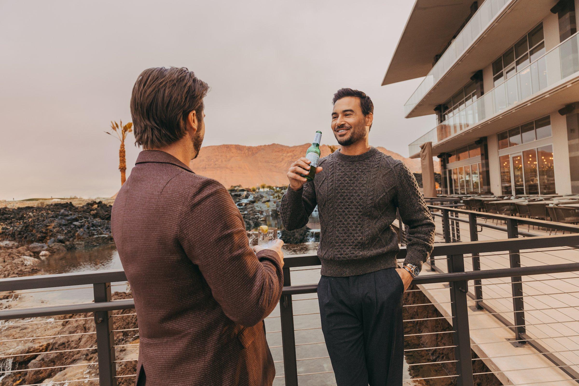 Two men hanging out on a patio at Black Desert Resort