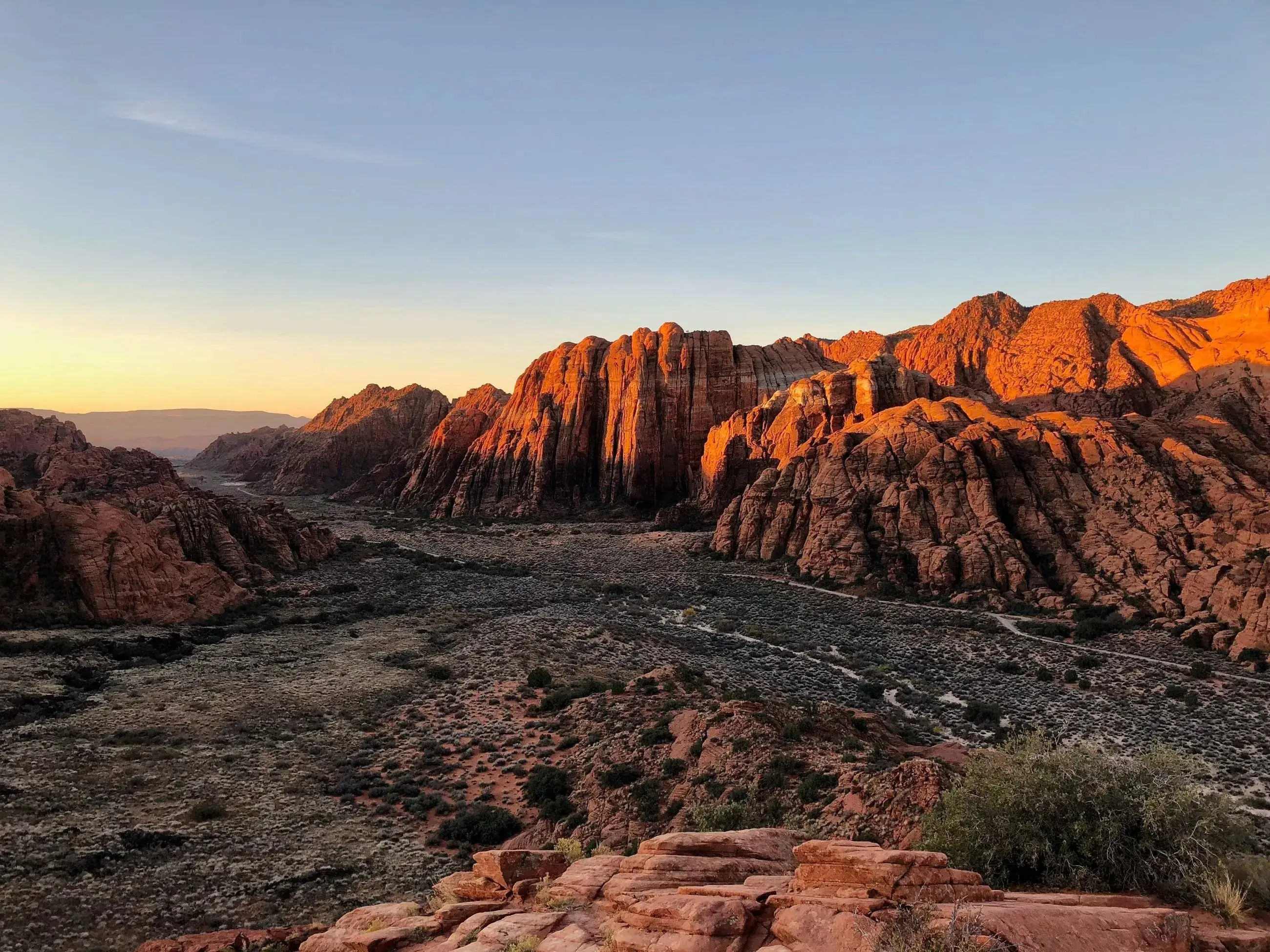A valley between mountains at sunset in Utah