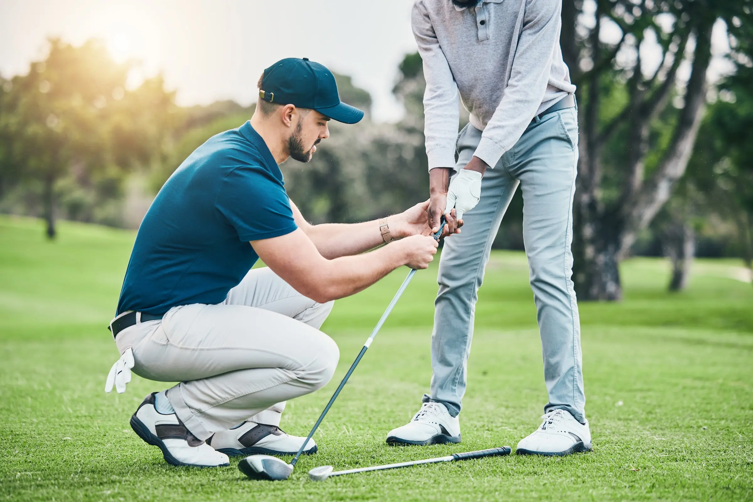 An instructor teaching a person how to golf at Black Desert Golf Course
