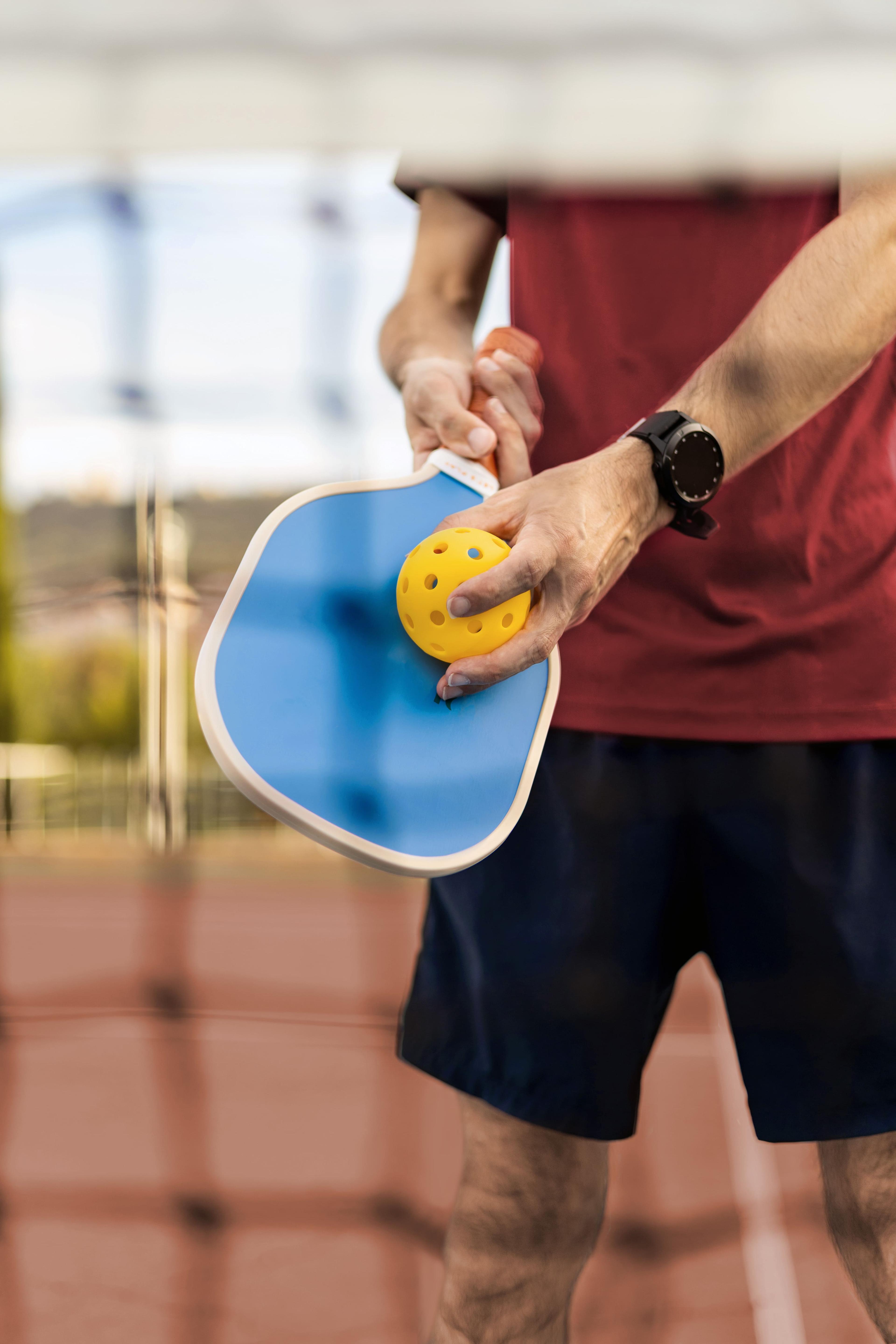 A person getting ready to serve at pickle ball at Black Desert Resort